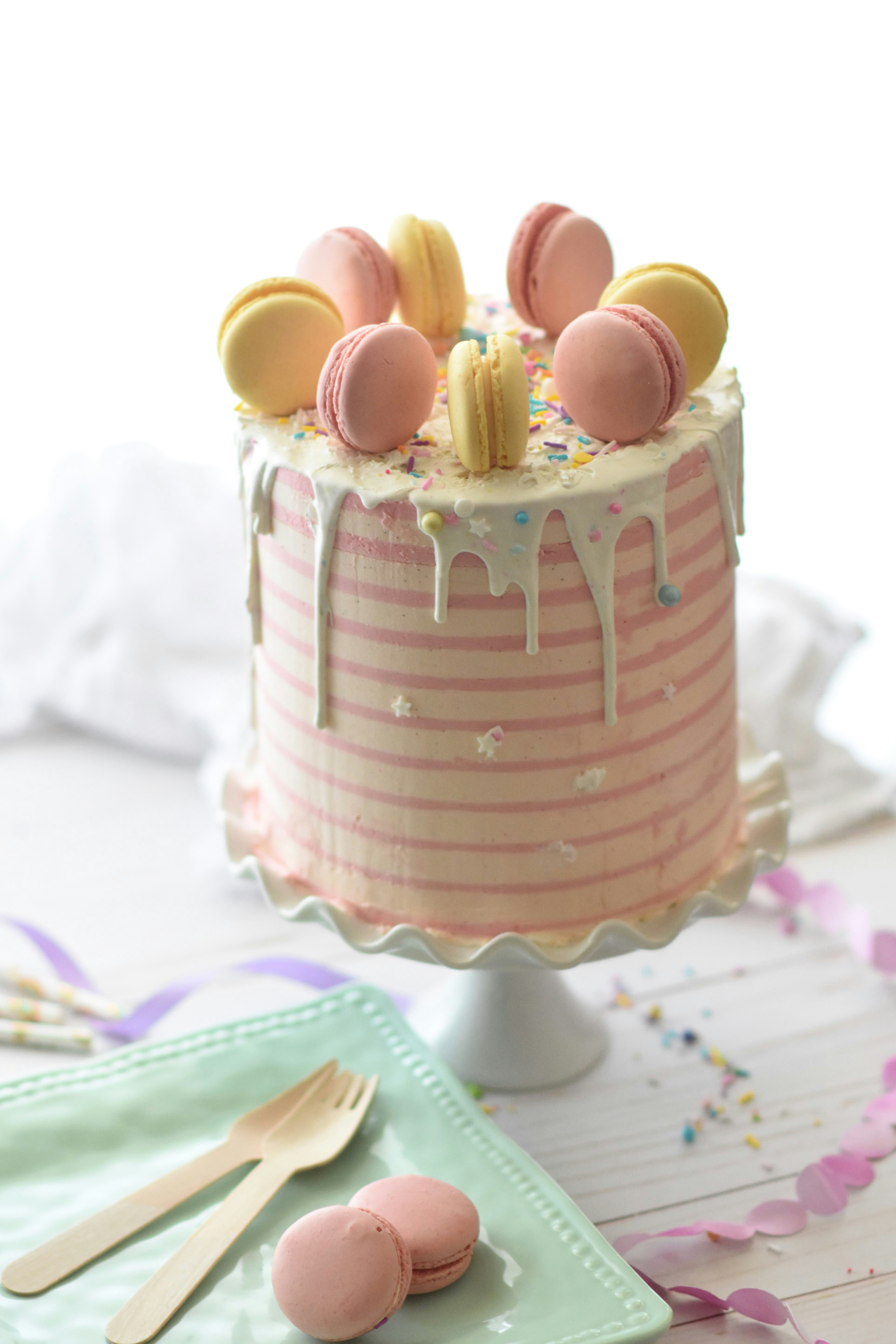 Pink cake with macarons on top